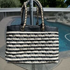 Betsey Johnson black and white strip bag with charms and pink bow